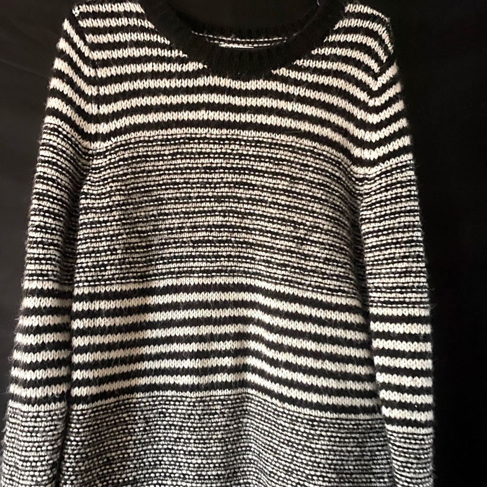 Knit black and white striped sweater.